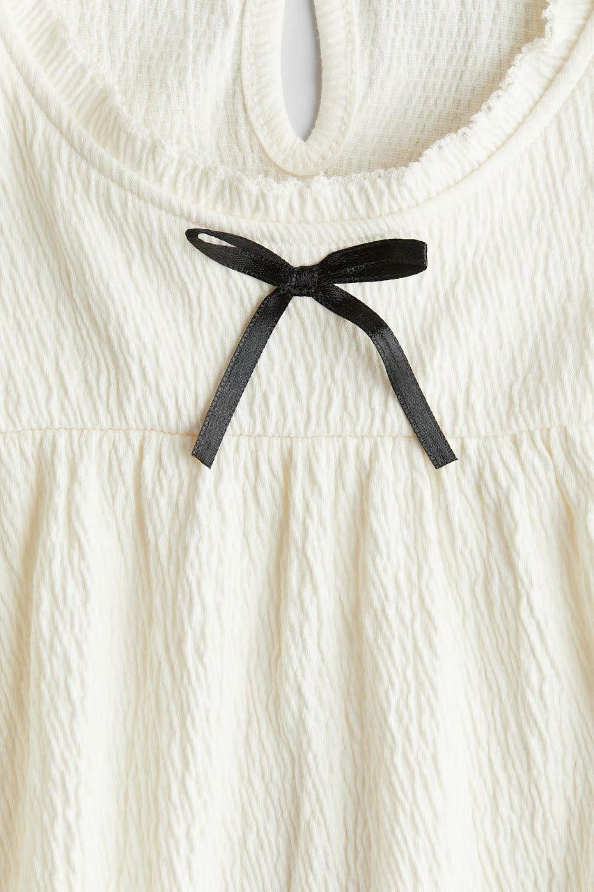 Camisa beige niña chongo H&M 1260561