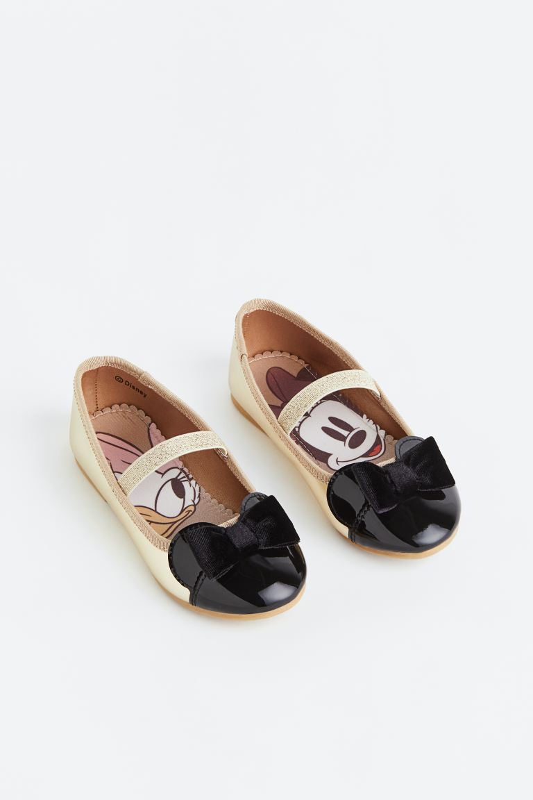 Zapatillas doradas negras H&M niña minnie disney