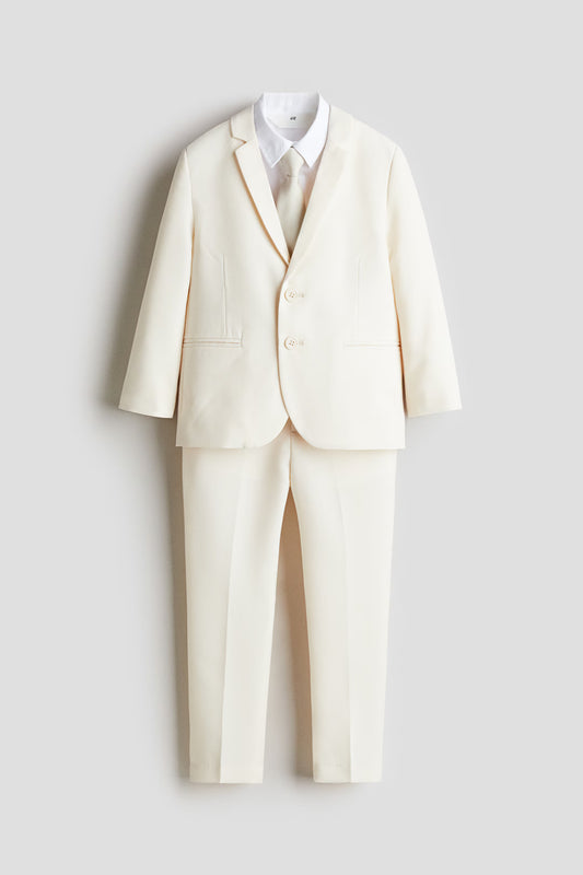 Set 4 piezas formal saco pantalon corbata camisa blanca beige niño H&M 1242064002