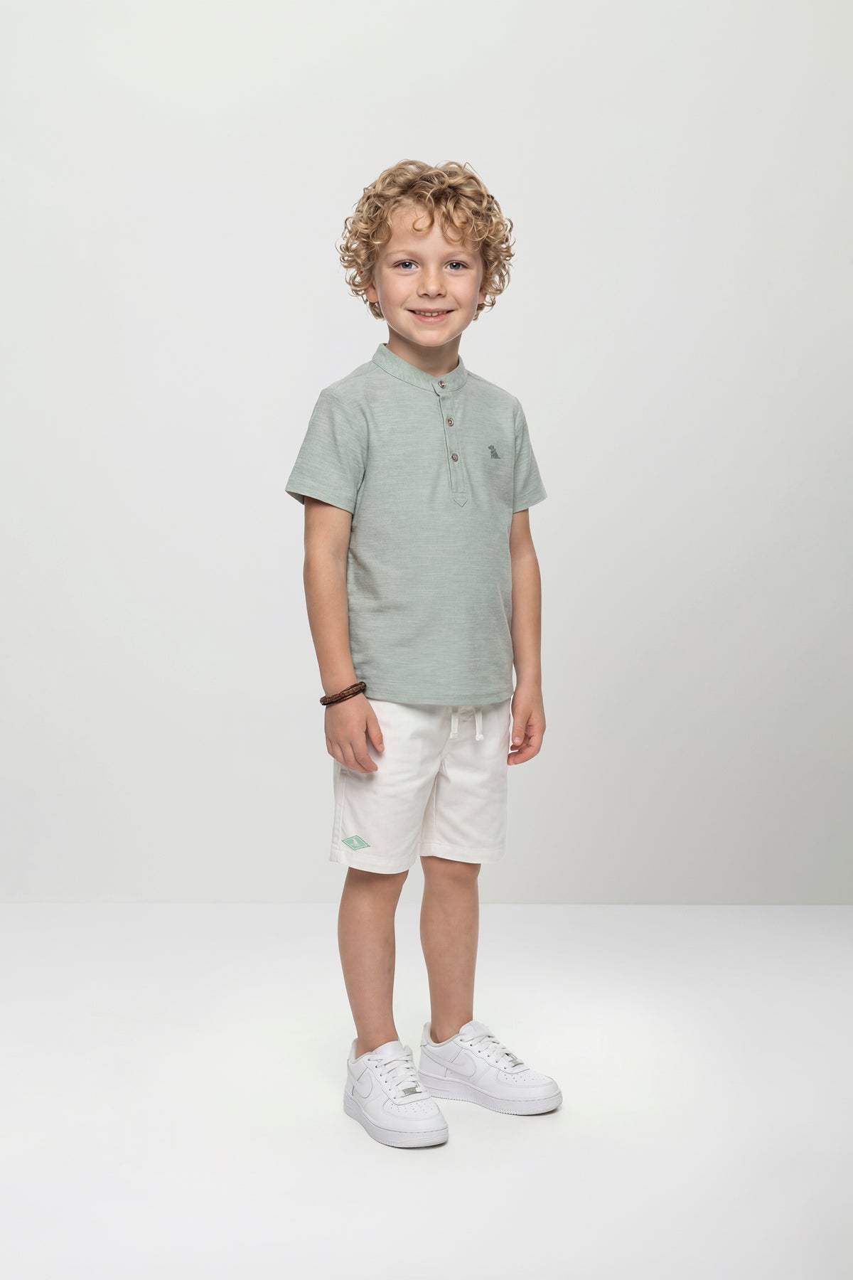 Set conjunto camisa verde short blanco niño Quimby 35156-145707