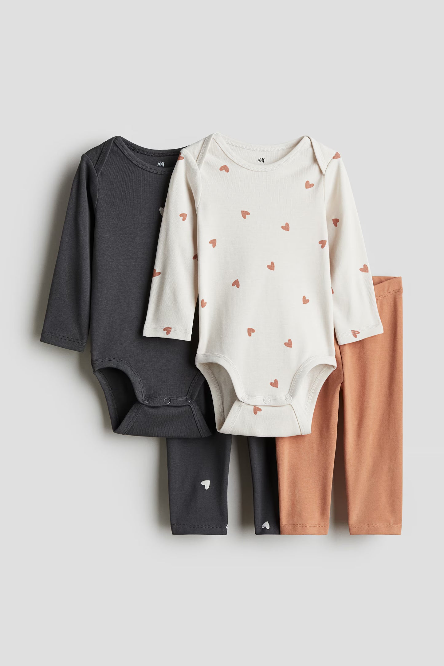 Set 4 piezas mameluco pantalon negro blanco bebe niña H&M 1226967004