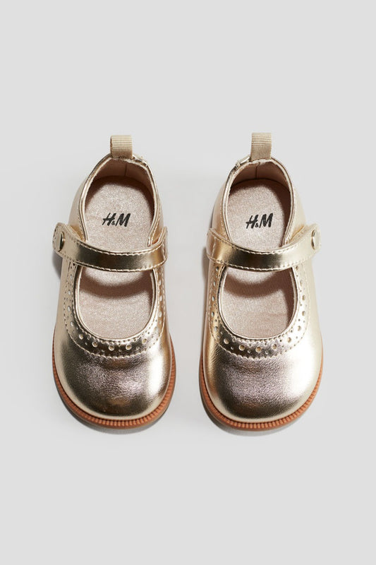 Zapatillas doradas bebe niña H&M