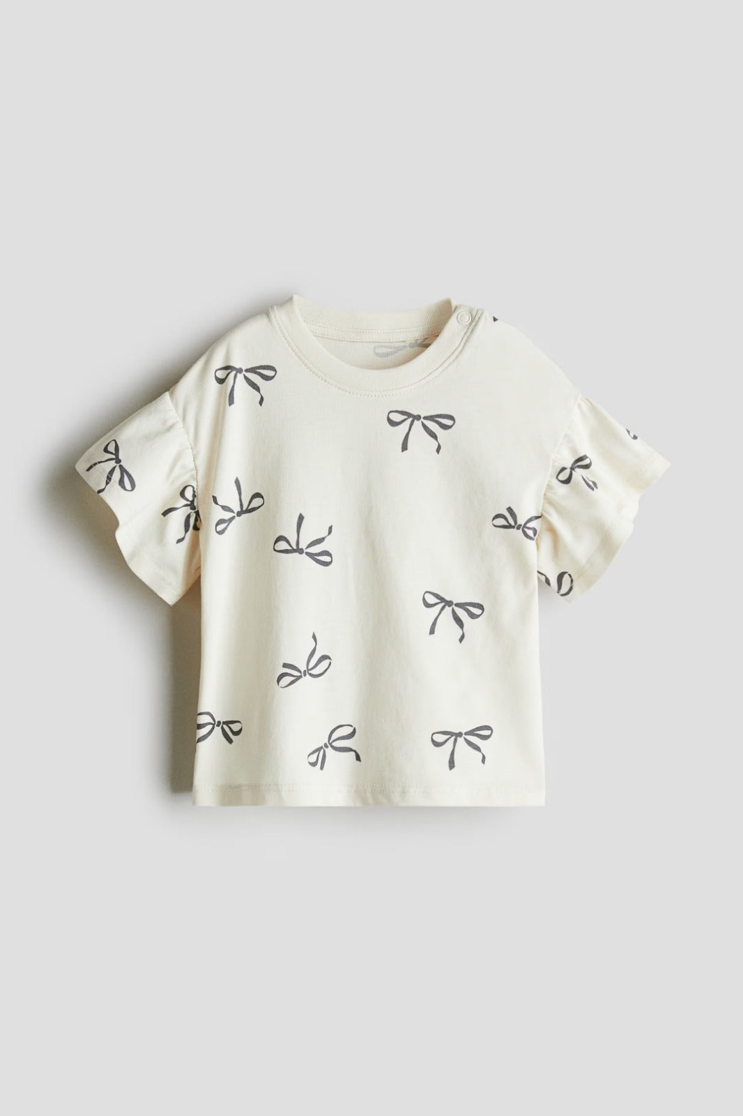 Camisa blanca niña chongo H&M 1296718001