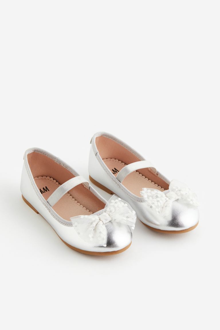 Zapatillas plateadas chongo H&M niña