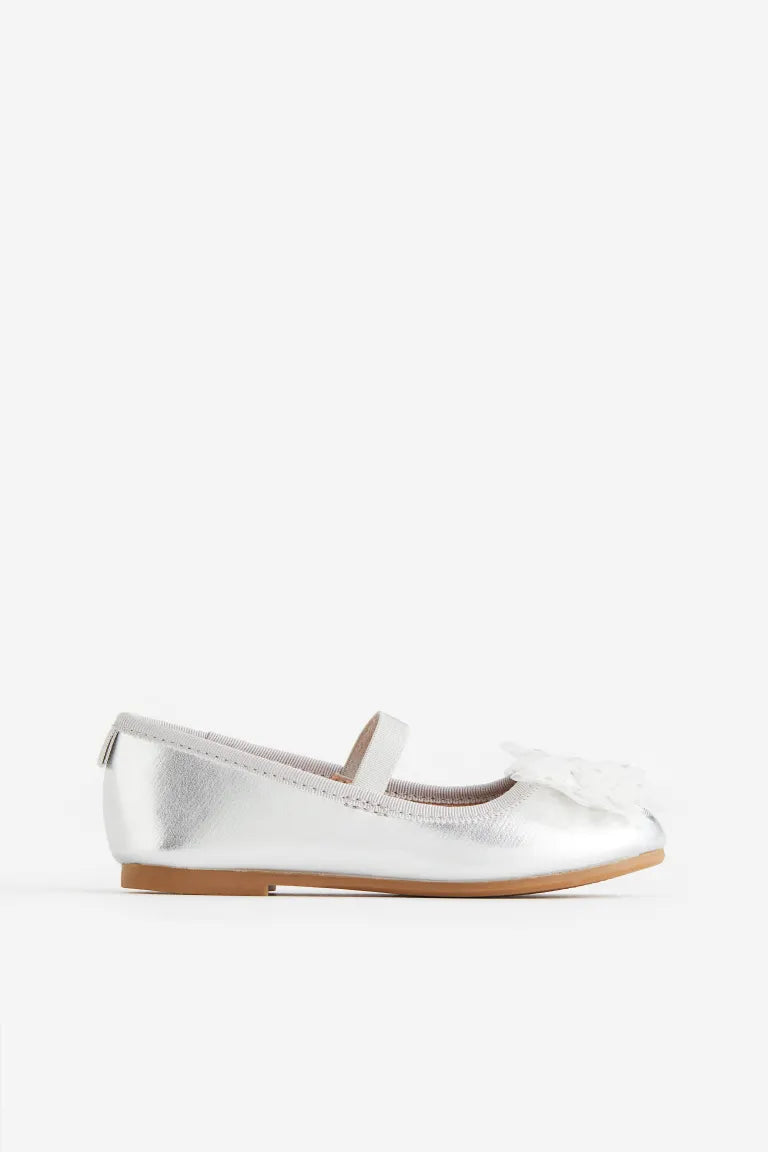 Zapatillas plateadas chongo H&M niña