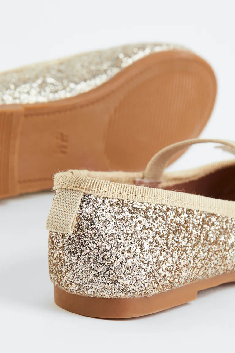 Zapatillas doradas chongo H&M niña